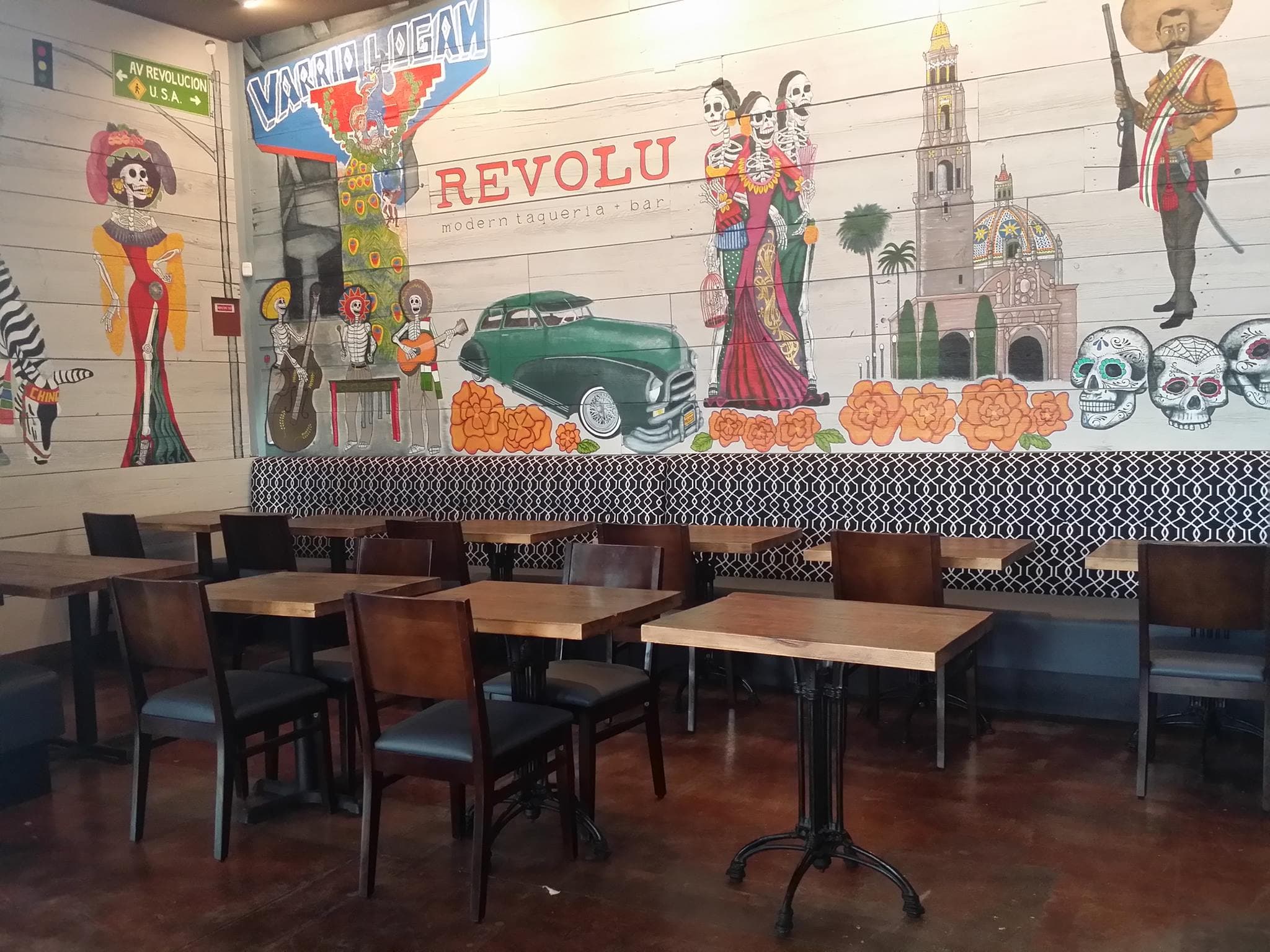 Colorful Mexican-themed mural in taqueria.
