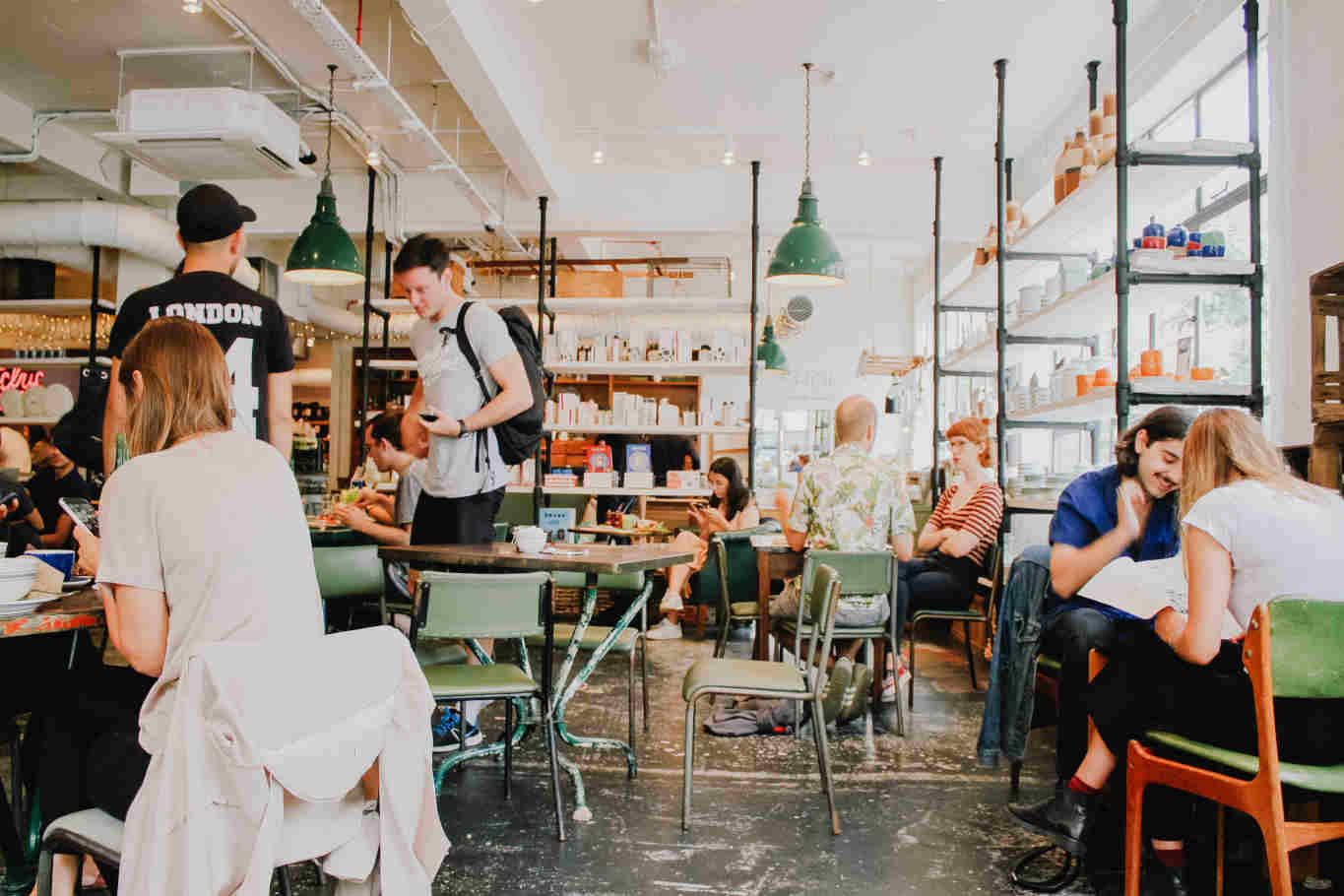 People socializing in a bustling coffee shop.