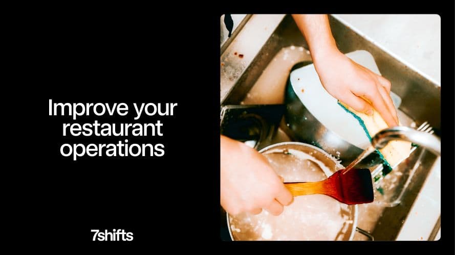 Person washing dishes in a restaurant kitchen.