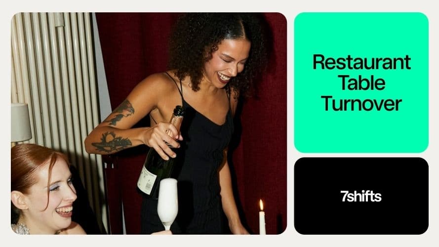 Smiling woman pouring champagne at restaurant event.