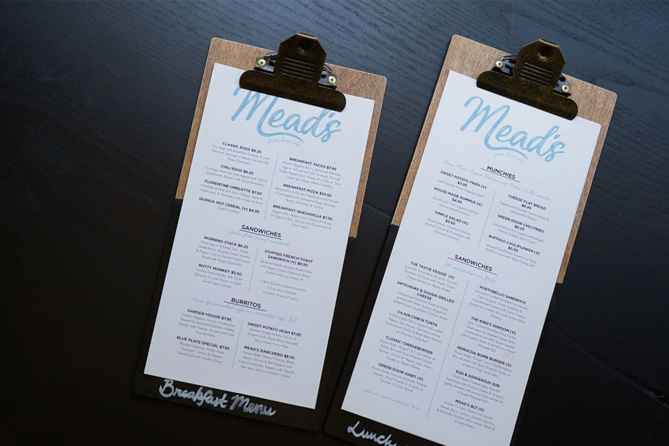 Breakfast and lunch menu on clipboards.